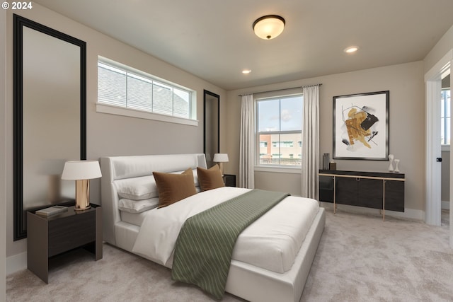 carpeted bedroom featuring multiple windows