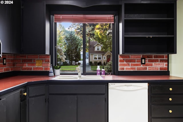 kitchen featuring dishwasher, backsplash, and sink