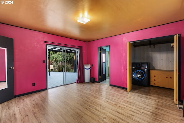 interior space with light hardwood / wood-style floors and washer / dryer