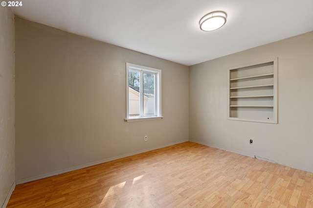 unfurnished room featuring light hardwood / wood-style floors