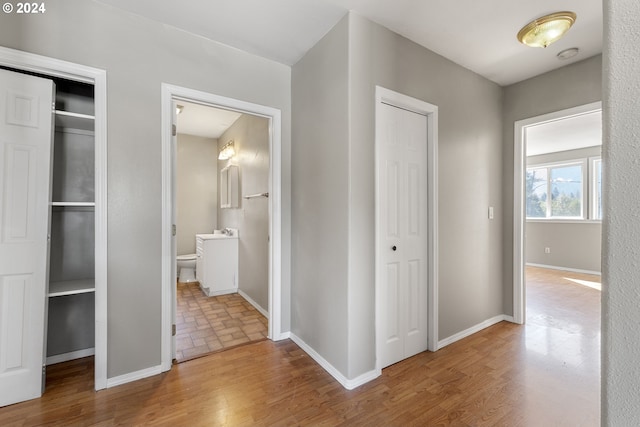 hallway featuring hardwood / wood-style flooring