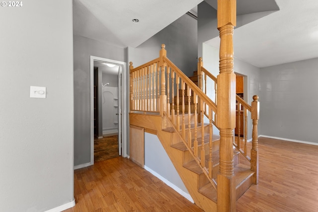 stairway featuring hardwood / wood-style floors