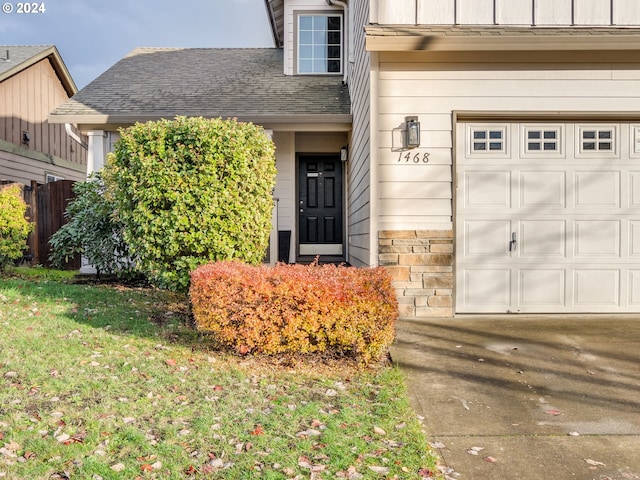 view of exterior entry featuring a garage