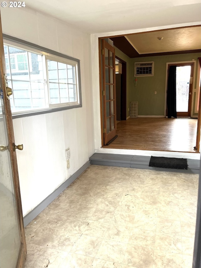 spare room featuring an AC wall unit