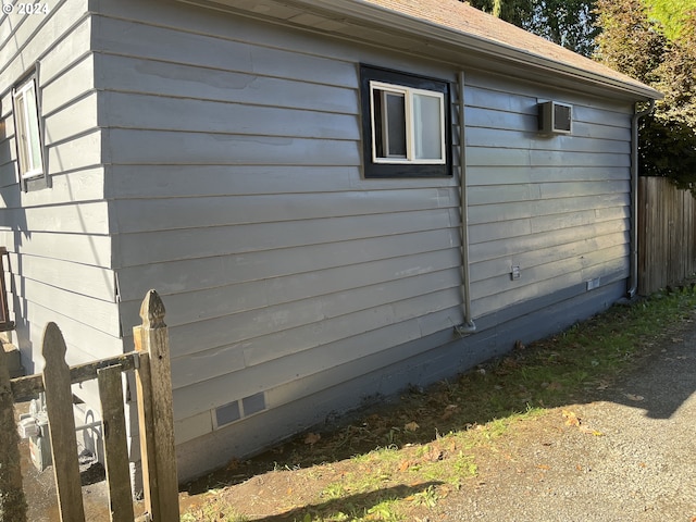 view of property exterior featuring fence