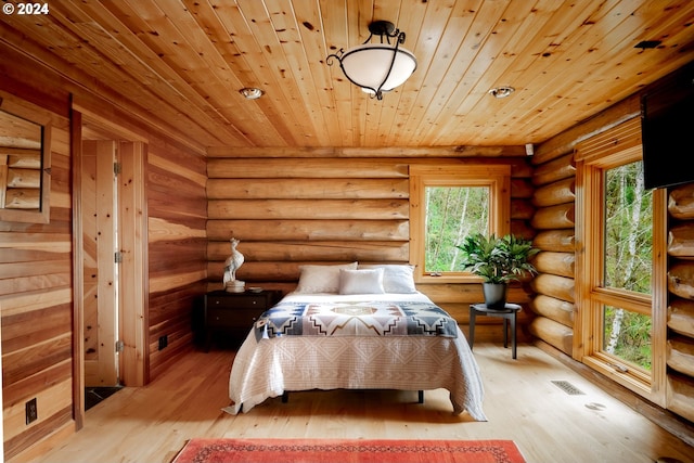 unfurnished bedroom featuring light wood-type flooring, rustic walls, and wood ceiling