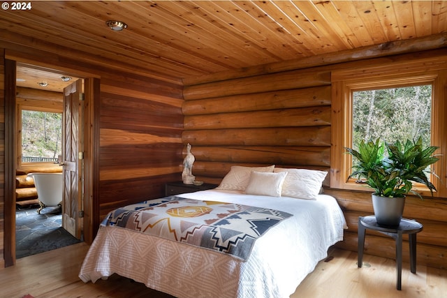 bedroom featuring rustic walls, light hardwood / wood-style flooring, multiple windows, and wood ceiling