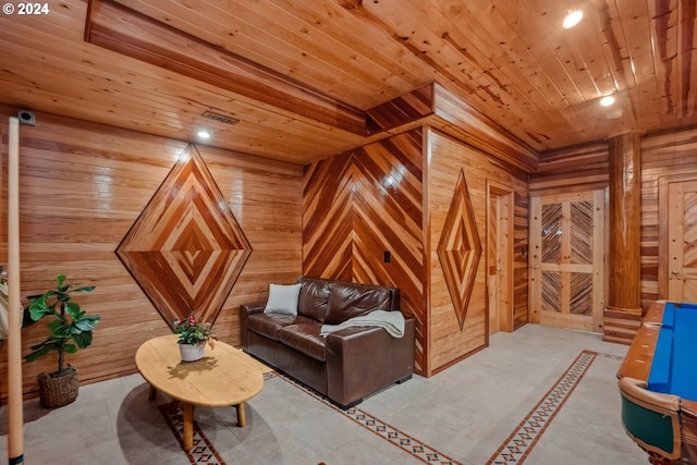 living area featuring wooden ceiling and wood walls