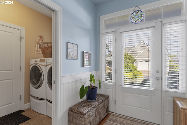 washroom featuring light tile patterned floors and washer and dryer