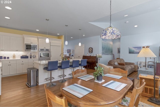 dining area with light wood-type flooring