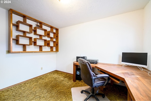 carpeted home office with a textured ceiling