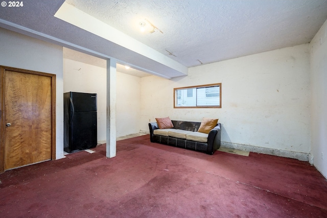 interior space with carpet floors and a textured ceiling