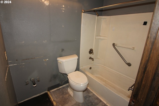 bathroom featuring shower / bathtub combination and toilet