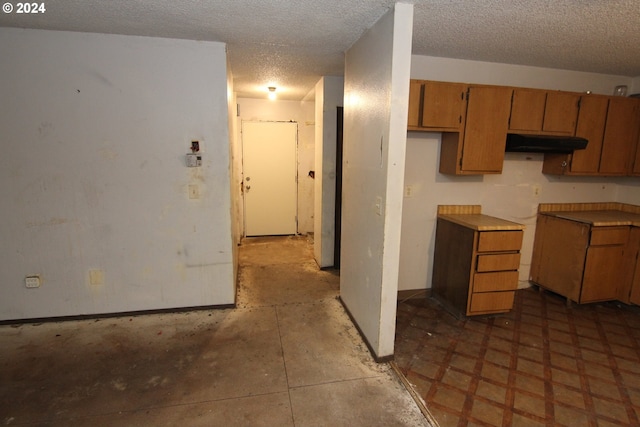 kitchen with a textured ceiling