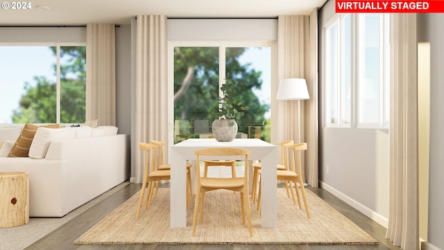 dining space with hardwood / wood-style floors