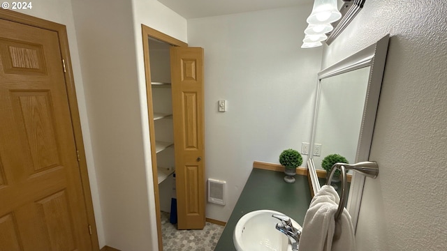 bathroom with tile patterned floors and sink