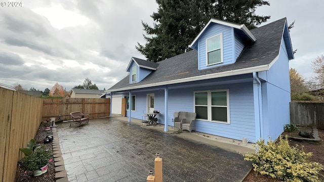 rear view of house featuring a patio