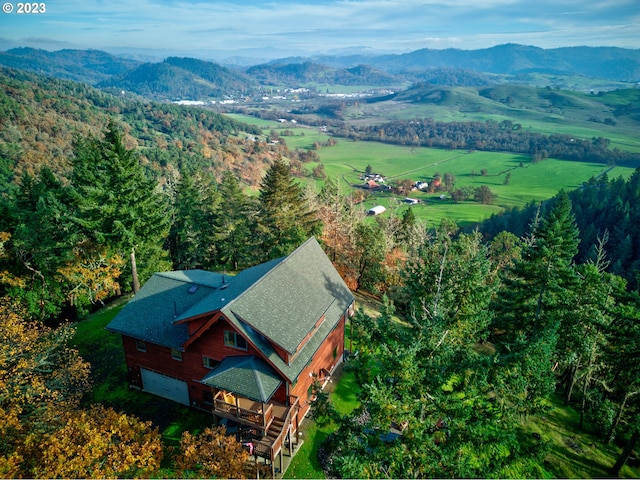 birds eye view of property featuring a mountain view