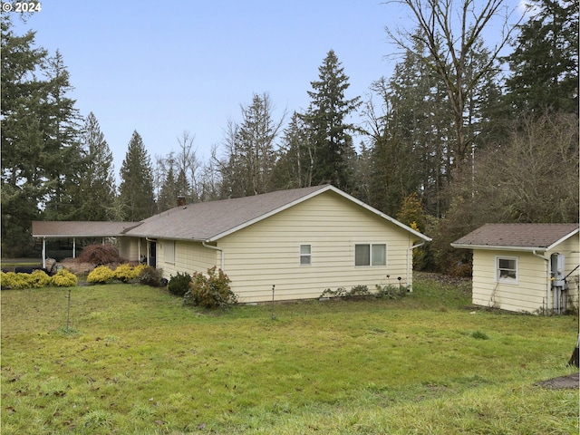 view of home's exterior with a lawn