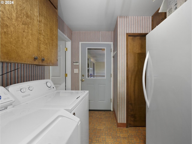 laundry area with cabinets and separate washer and dryer