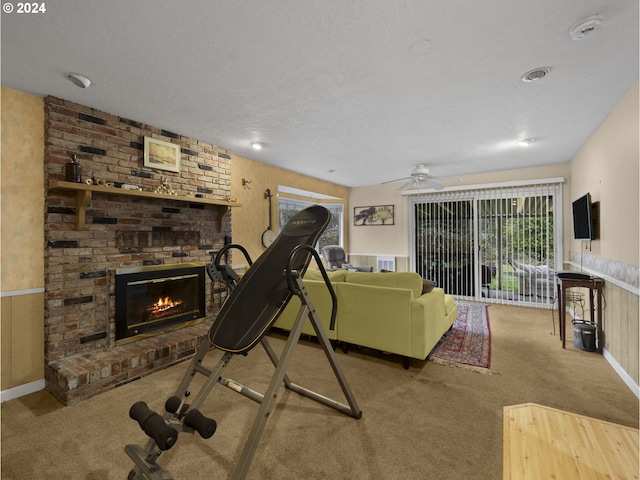 15600 SE Orient Dr, Boring, OR 97009 - living room with carpet flooring, a fireplace, healthy amount of natural light, a ceiling fan, and a textured ceiling