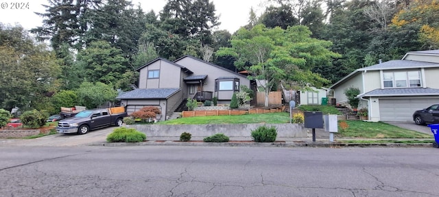 view of front of house with a front lawn and a garage