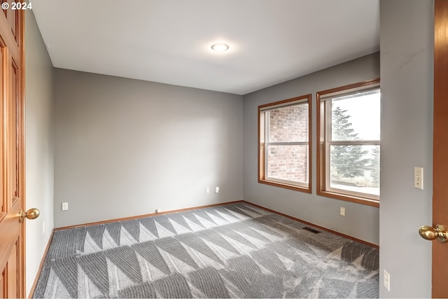 spare room with light colored carpet