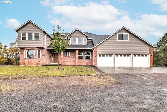 front of property with a front lawn and a garage