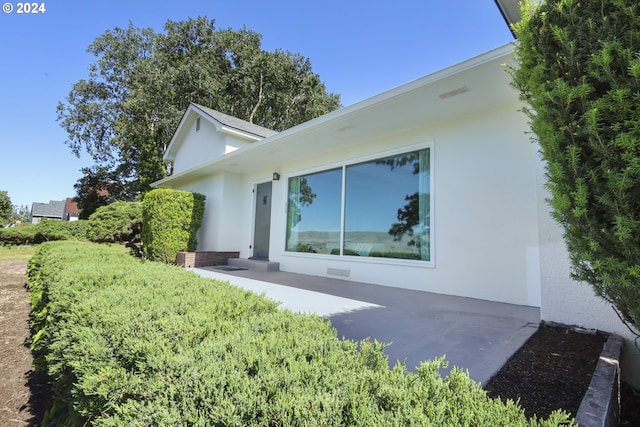 back of house featuring a patio area