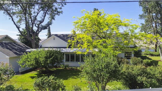 view of side of property featuring a yard