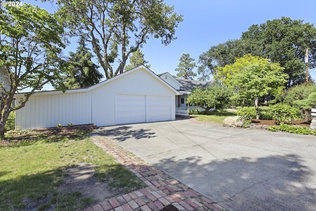 view of side of property with a garage