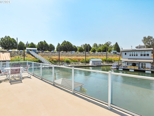 view of swimming pool featuring a water view