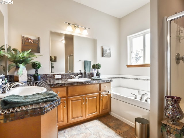 bathroom with shower with separate bathtub, tile patterned flooring, and vanity