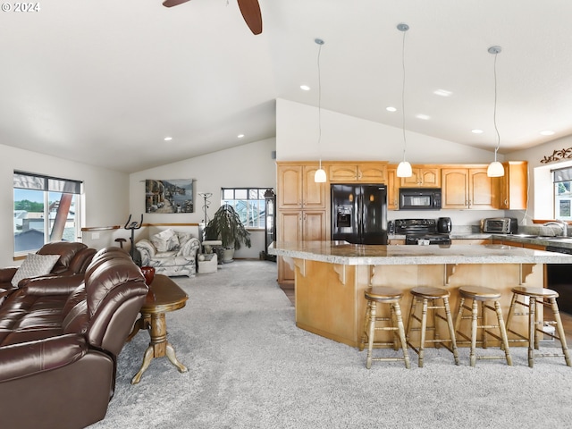 kitchen with hanging light fixtures, black appliances, lofted ceiling, ceiling fan, and light carpet