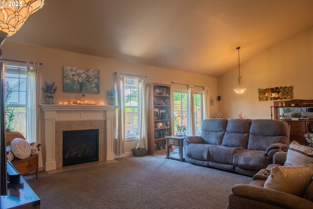 1008 S 41st St, Springfield, OR 97478 - living area with carpet floors, plenty of natural light, vaulted ceiling, and a tile fireplace