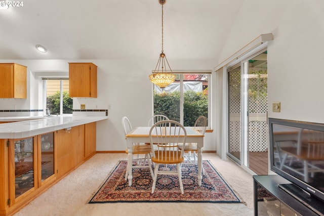 dining area featuring lofted ceiling