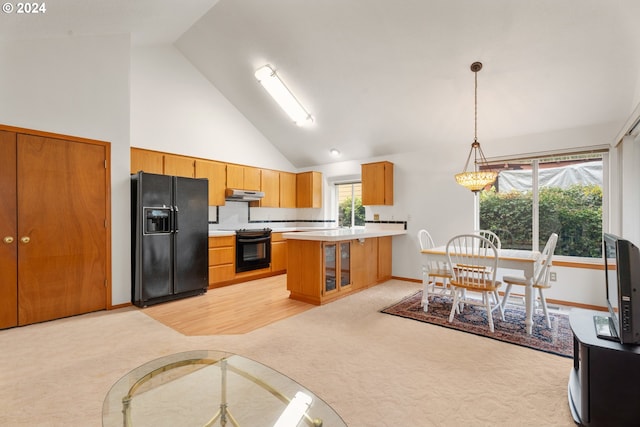 kitchen featuring light colored carpet, black appliances, high vaulted ceiling, backsplash, and decorative light fixtures