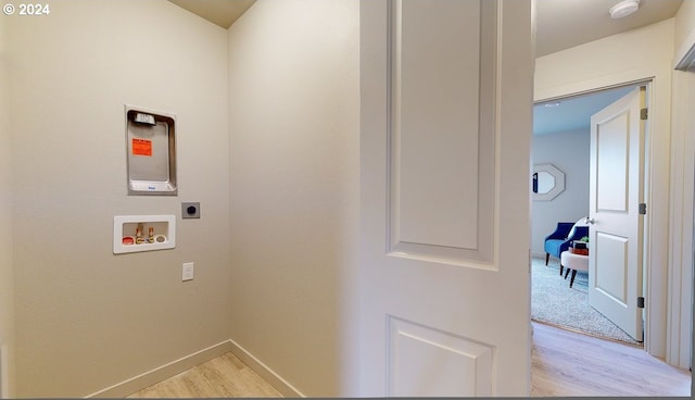 laundry room featuring light carpet, washer hookup, and hookup for an electric dryer