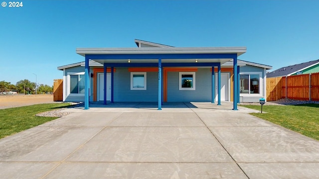 view of front of house with a porch and a front yard