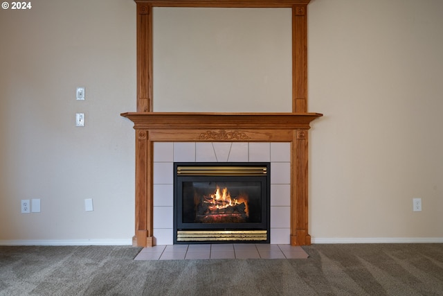 room details featuring a fireplace and carpet floors