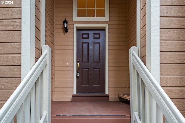 view of exterior entry with brick siding