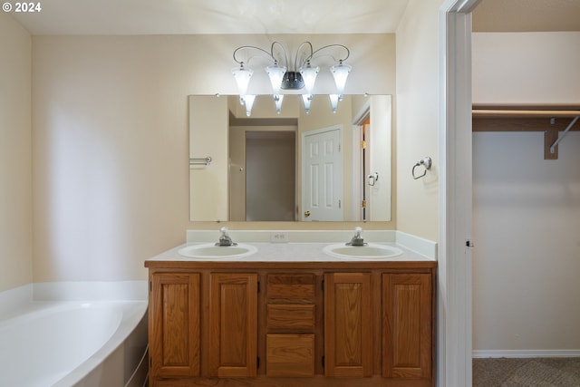 bathroom with vanity and a tub to relax in