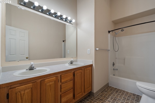 full bathroom featuring bathing tub / shower combination, tile patterned flooring, vanity, and toilet