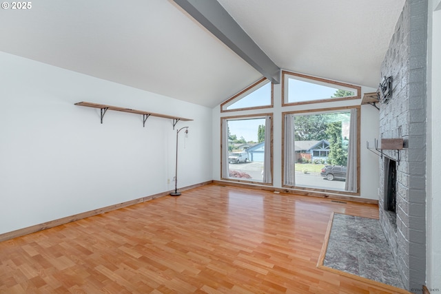 1504 SW 24th St, Troutdale, OR 97060 - unfurnished living room featuring light wood-type flooring, a brick fireplace, and baseboards