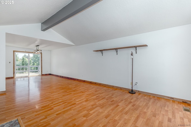 1504 SW 24th St, Troutdale, OR 97060 - unfurnished living room with light wood-type flooring, a chandelier, and baseboards