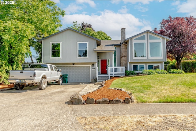 1504 SW 24th St, Troutdale, OR 97060 - raised ranch with driveway, a garage, a chimney, and a front yard