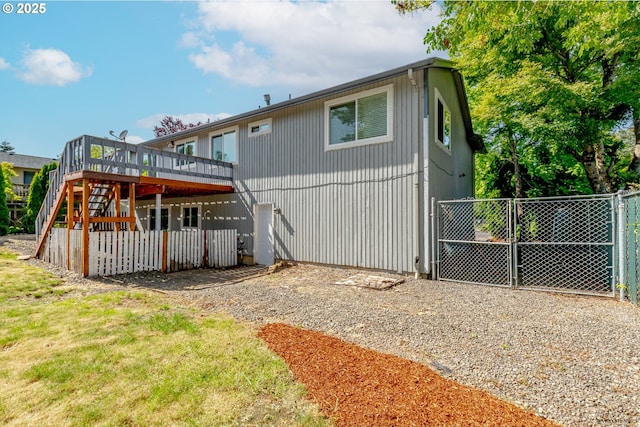 1504 SW 24th St, Troutdale, OR 97060 - rear view of property featuring a wooden deck, stairway, and a gate