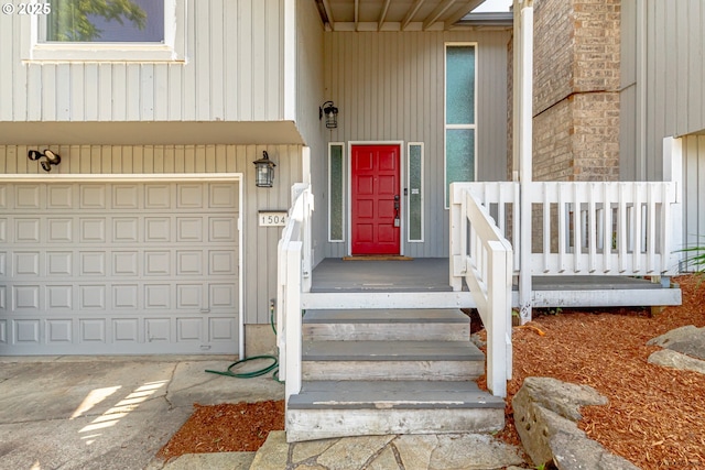 1504 SW 24th St, Troutdale, OR 97060 - doorway to property featuring an attached garage and concrete driveway