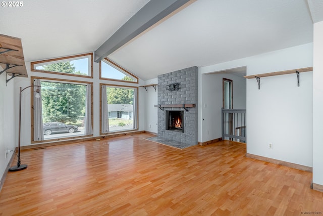 1504 SW 24th St, Troutdale, OR 97060 - unfurnished living room featuring light wood-style flooring, a brick fireplace, and baseboards