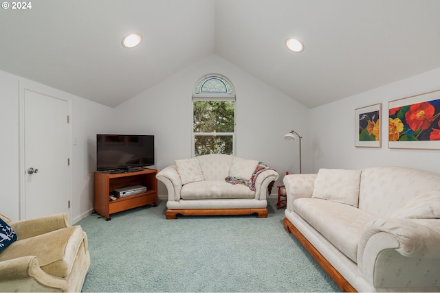 living room with lofted ceiling and carpet flooring